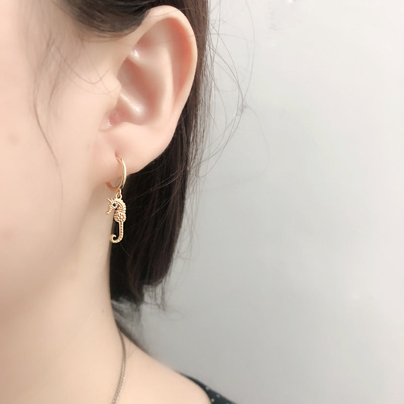 S925 Eye & Seahorse Huggie Earrings — product view